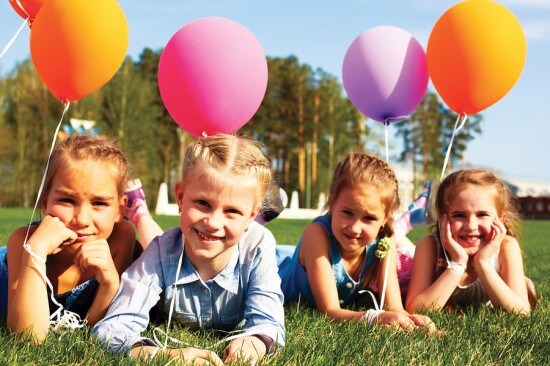 Group Of Happy Children With Balloons