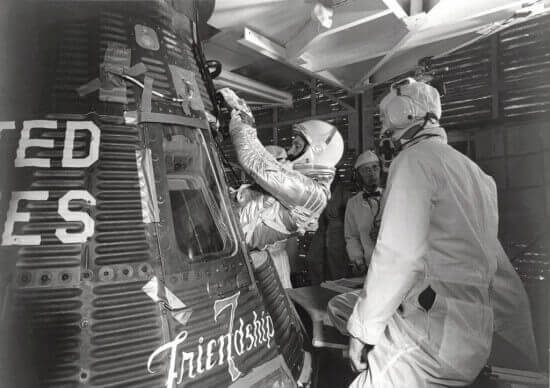 Astronaut John H. Glenn Jr. enters his Mercury capsule, "Friendship 7" as he prepares for launch of the Mercury-Atlas rocket. 