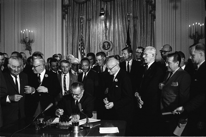 1200px-Lyndon_Johnson_signing_Civil_Rights_Act,_July_2,_1964