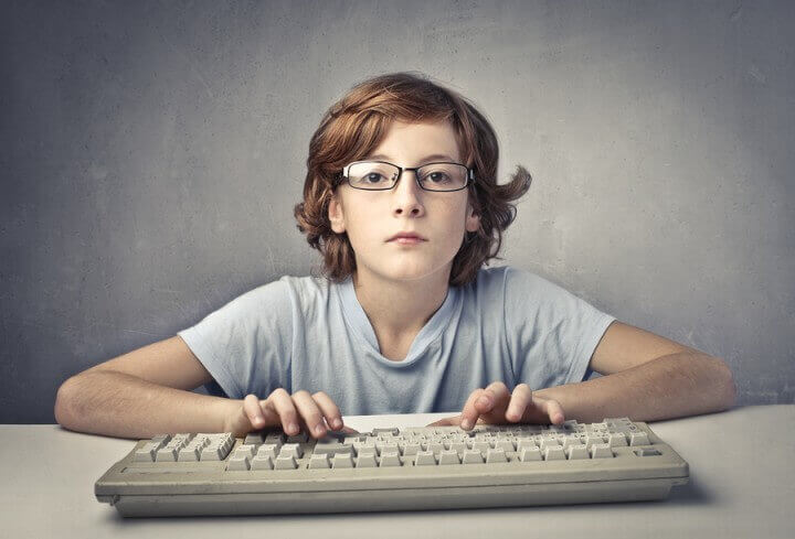 Child Typing On A Computer Key