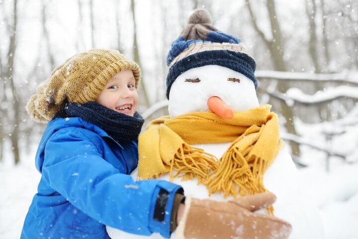 Boy Building Snowman
